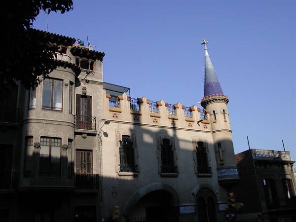 Modernist building with crenellated tower and mosaic spire, Barcelona