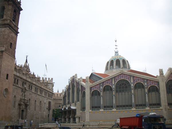 Valencia's Central Market with tiled dome beside the church tower