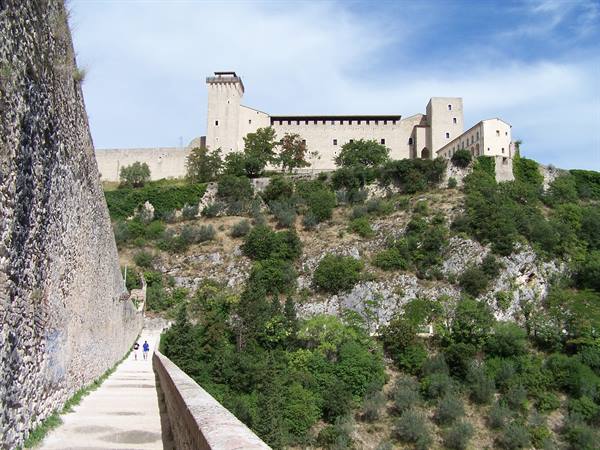 Walk along Ponte delle Torri toward the Rocca Albornoziana in Spoleto
