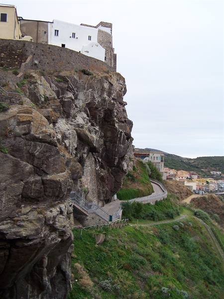 Lipari castle perched on volcanic rock above the harbour road