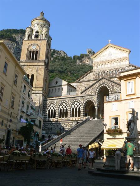 Amalfi Cathedral: crowded staircase and striped bell tower under sunny sky