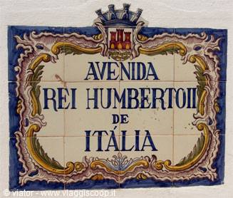 Ceramic azulejo street sign with crest reading Avenida Rei Humberto II de Itália