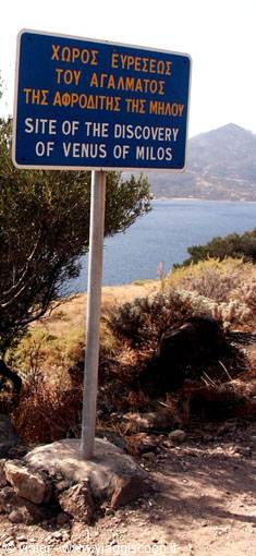 Bilingual sign marking the site where the Venus de Milo was found, above the bay