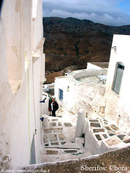 Chora on Serifos: whitewashed alley with stone steps and dry hills