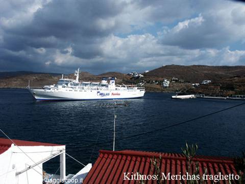 Hellas Ferries ferry docking at Merichas harbor, red rooftops and dry hills
