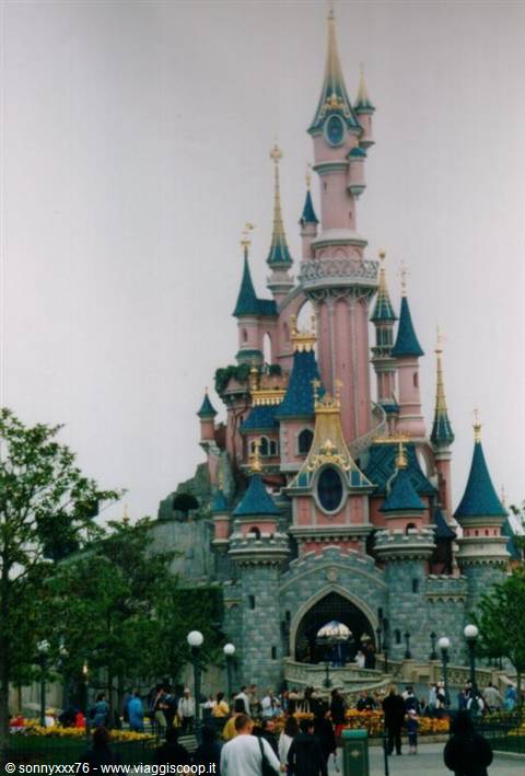Sleeping Beauty Castle at Disneyland Paris, visitors walking around