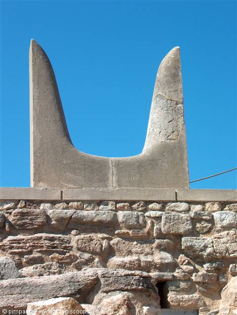 Minoan stone sacrificial horn atop ancient walls, Knossos