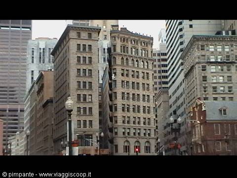 Historic stone buildings in downtown Boston, traffic waiting at lights