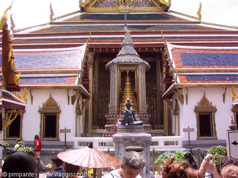 Bronze statue in front of the golden temple at the Grand Palace, Bangkok