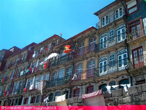 Old facades with wrought-iron balconies and hanging laundry, Porto Ribeira