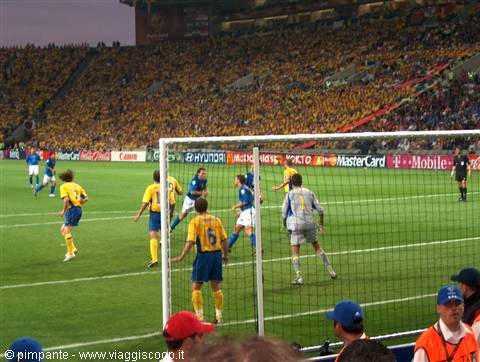 Football match at the stadium: Italy players against Sweden in yellow shirts