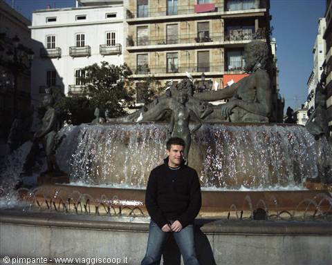 Sitting by the Turia fountain at Plaza de la Virgen, Valencia