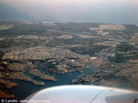 Malta's Grand Harbour seen from the plane, white engine in foreground