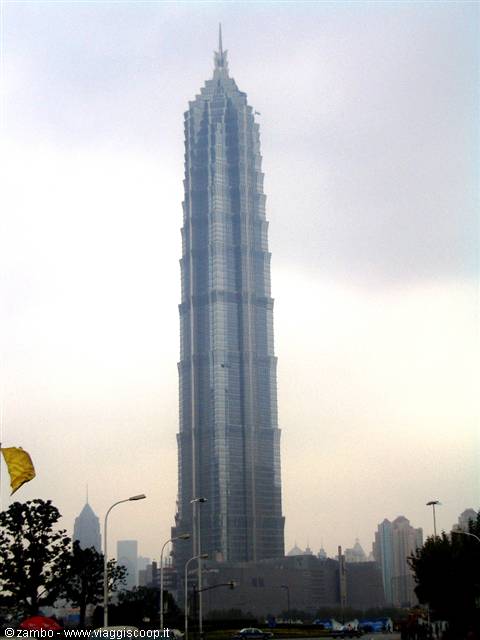 Jin Mao Tower in Shanghai, glass and steel under grey sky