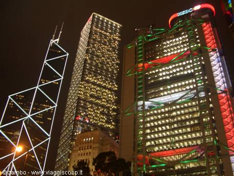 Illuminated Hong Kong skyscrapers at night, with HSBC headquarters and Bank of China Tower