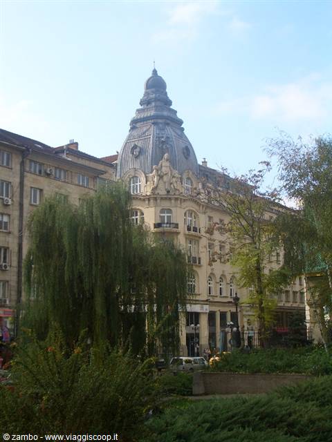 Art Nouveau building with metal dome among trees in Plovdiv park