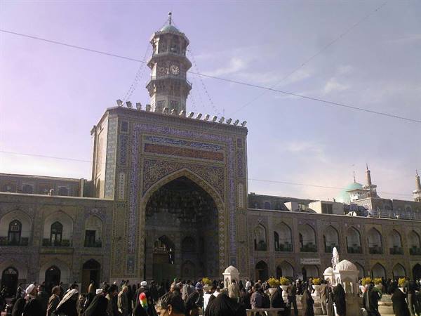 Pilgrims before the tiled entrance of the Imam Reza shrine in Mashhad