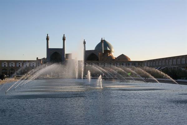 Fountains in Naqsh-e Jahan pool, Esfahan, Shah Mosque in the background