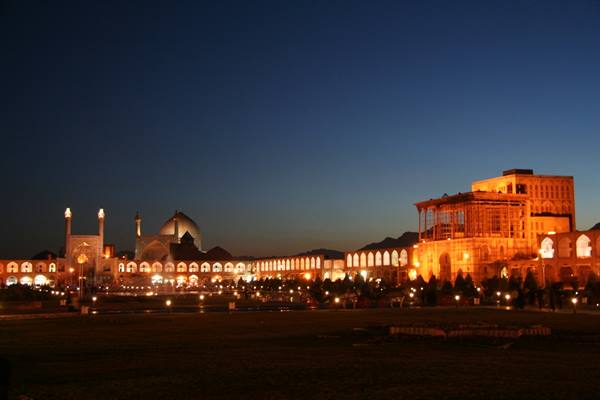 Naqsh-e Jahan Square in Isfahan illuminated at dusk, with Ali Qapu