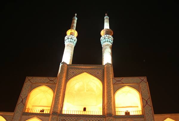 Illuminated iwan and twin minarets at night, Amir Chakhmaq, Yazd