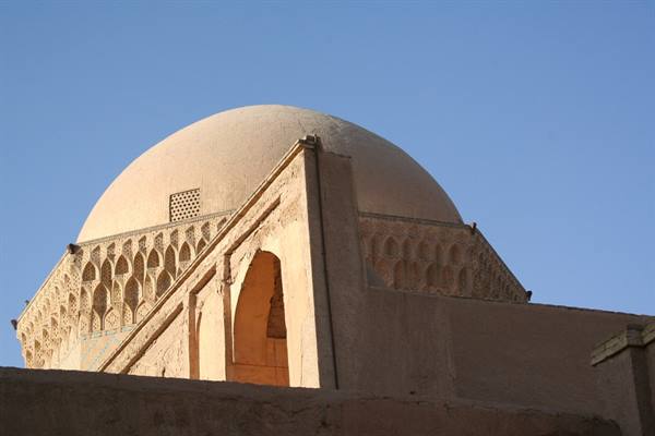 Brick dome of Esfahan mosque under blue sky
