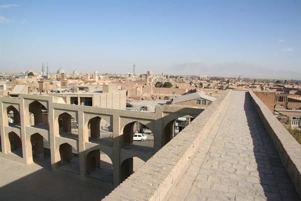 Brick walkway with arches above the Amir Chakhmaq complex in Yazd
