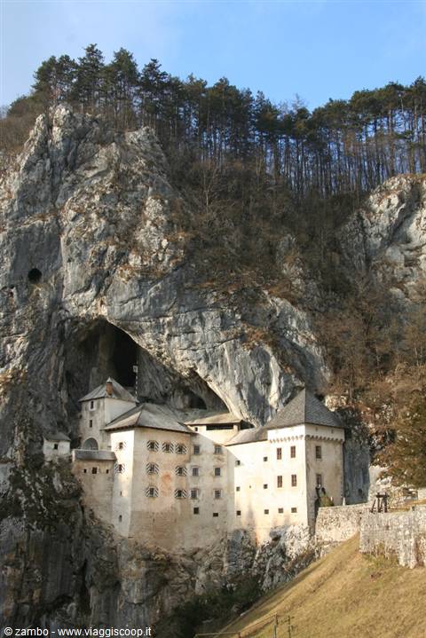 Predjama Castle built into the limestone cliff beneath the cave mouth