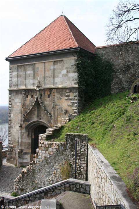 Gothic stone gateway with red-tiled tower at Bratislava Castle