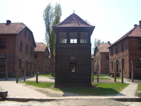 Wooden guard tower among brick barracks, Auschwitz