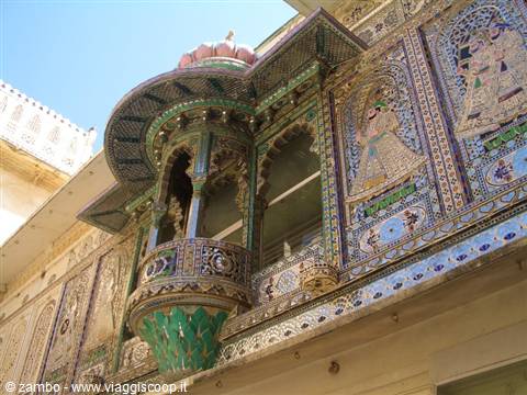Mirrored mosaic balcony of Udaipur City Palace under bright sunlight