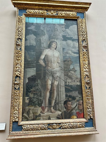 In front of an ancient Saint Sebastian, we stop in silence to contemplate.