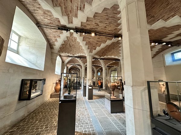 Exploring the museum's wonders under the brick vaults.