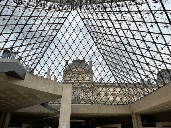 Under the Louvre's glass pyramid, time seems suspended.