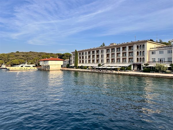 Golden afternoon on the promenade of Opatija, among cafés and blue sea.