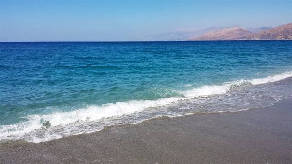 The sea caressing the shore, moments of pure Greek serenity.