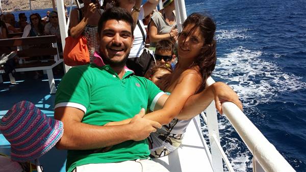 Smiling in the wind at sea, on a cruise all together.