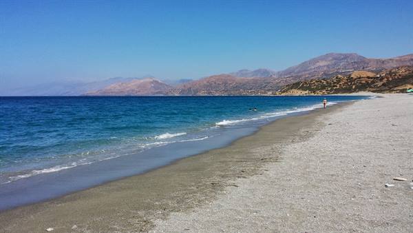 A long walk on the beach under the sun of Crete.
