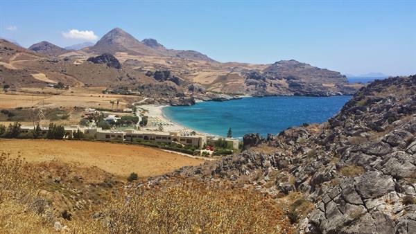 Walking among the hills of Rhodes, the turquoise bay welcomes us with wonder.