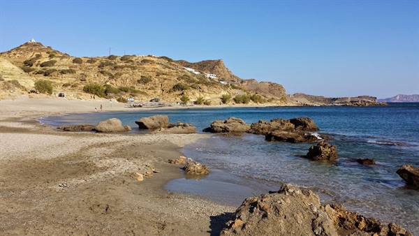 A wild and silent cove, under the golden sun of Crete.