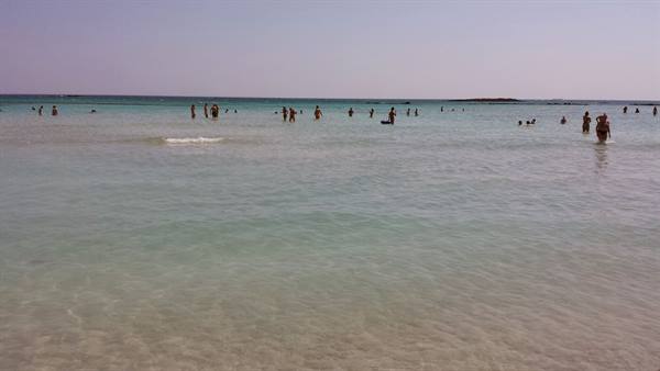 Turquoise, warm waters: a day of pure relaxation at the beach.