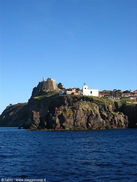 San Giorgio fort and white lighthouse on Capraia's rocky cliffs