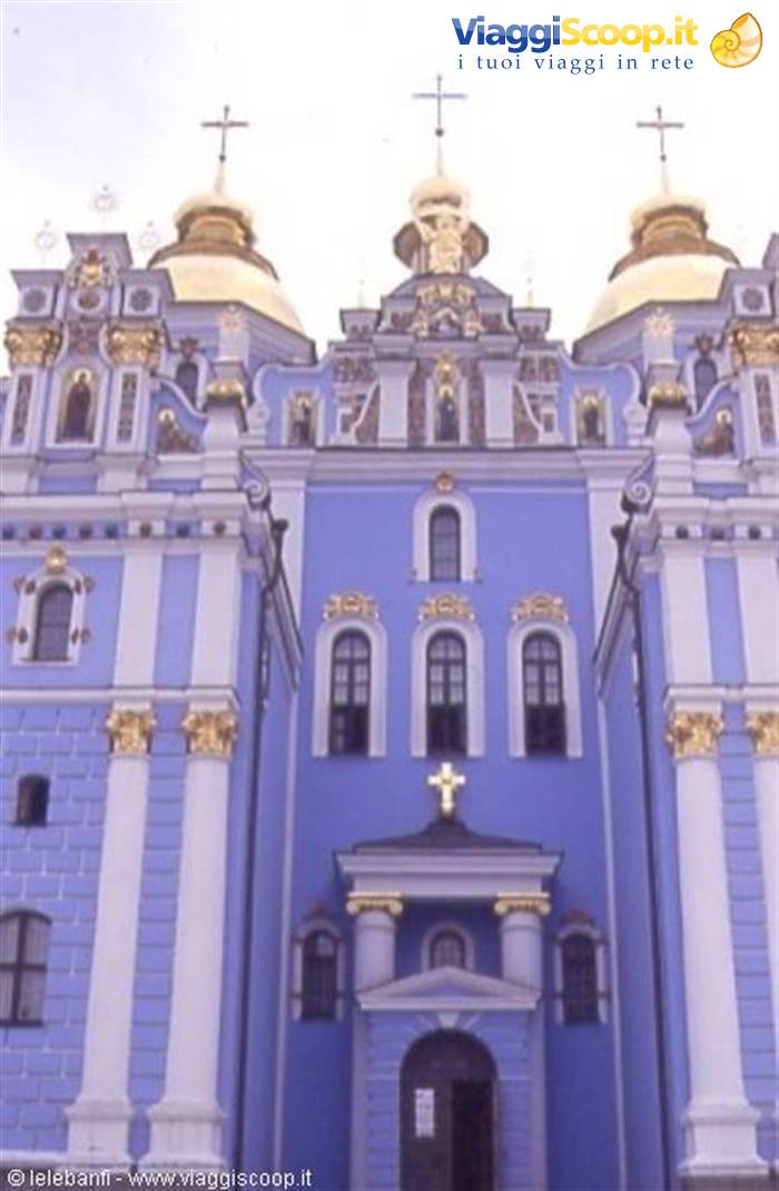 Blue façade with gilded domes and crosses of St Michael's Cathedral in Kyiv