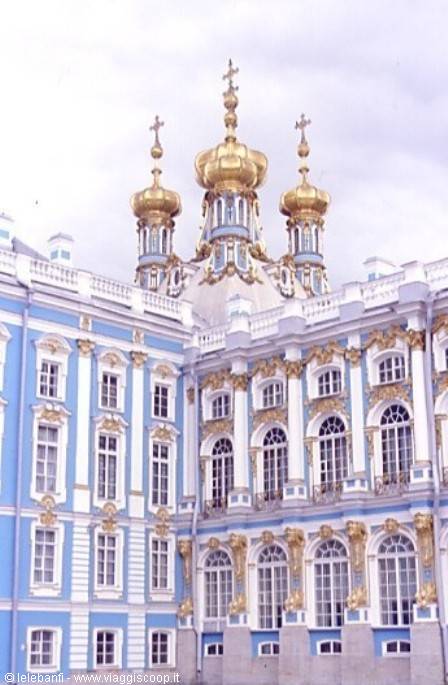 Catherine Palace at Tsarskoye Selo, blue facade with gilded domes under gray sky