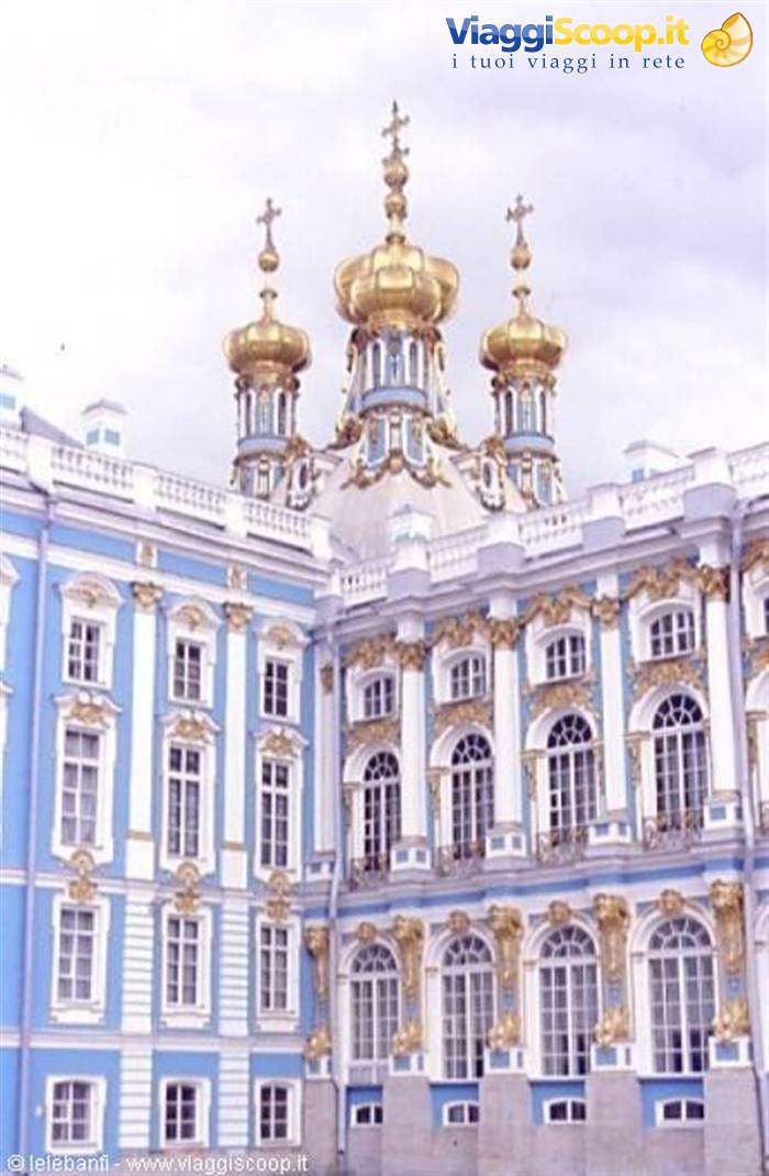 Catherine Palace at Tsarskoye Selo, blue facade with gilded domes under gray sky