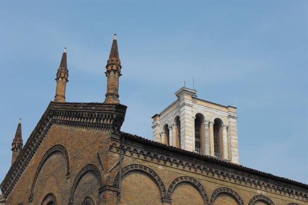 Brick spires and marble bell tower of Modena Cathedral