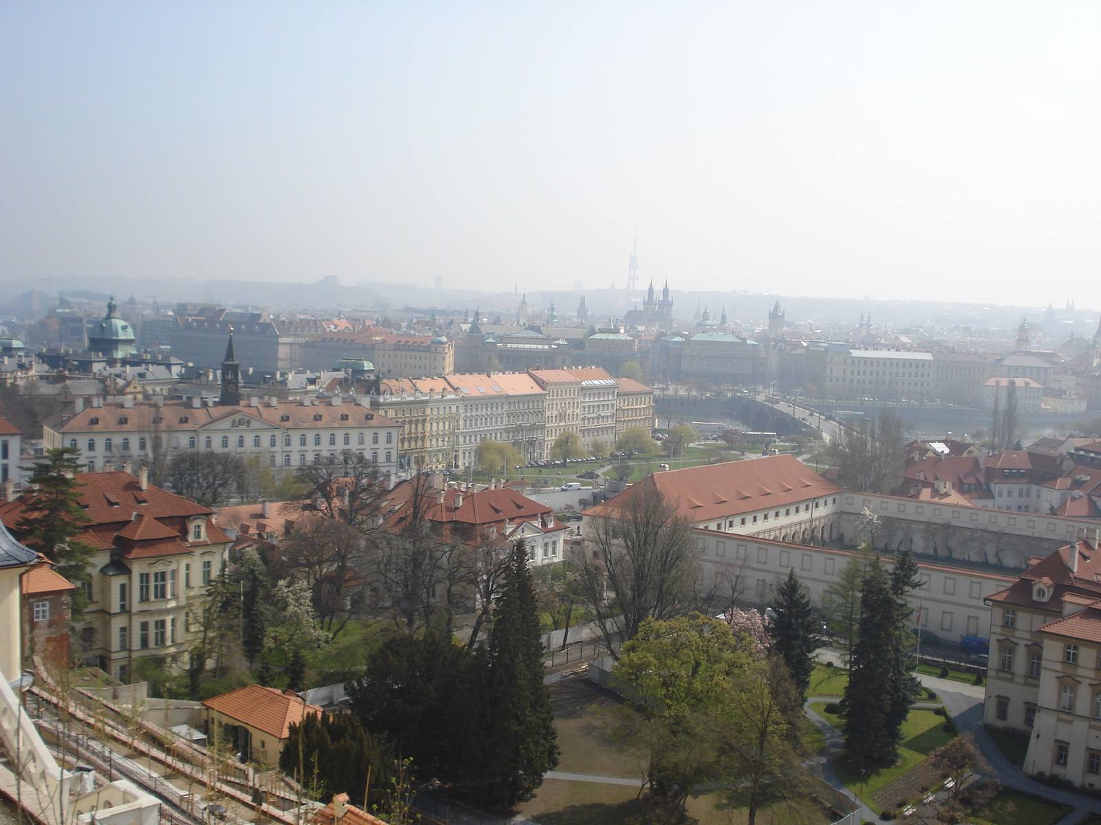 Red rooftops and green gardens shrouded in haze, Prague