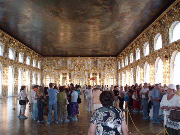 Tourists in the Great Hall of Catherine Palace, Tsarskoye Selo, gilded walls and painted ceiling