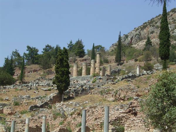 Ancient temple columns of Apollo amid cypresses at Delphi