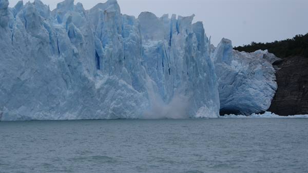 Perito Moreno glacier, blue ice wall calving into the lake
