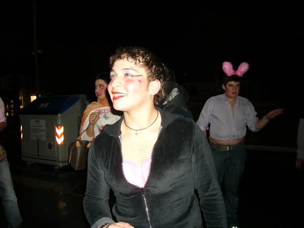 Night carnival in Viareggio: costumed revelers, one wearing pink bunny ears